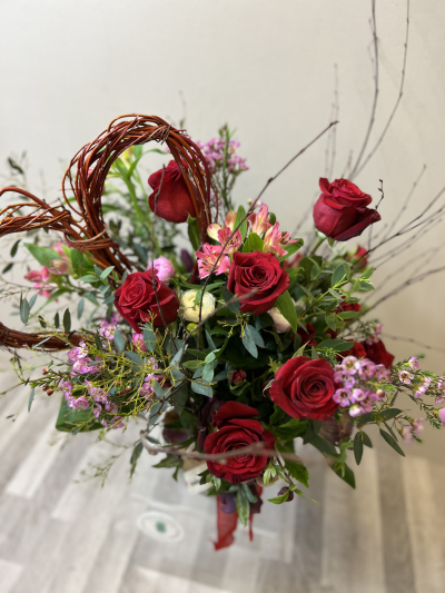 Hearts & Flowers - 3 or 6  Roses included with seasonal flowers arranged in a beautiful bouquet with handmade willow heart. Gift wrapped or why not add glass vase and chocolates