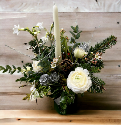 Shining Light - White Christmas themed table arrangement or festive gift with slow burning candle surrounded with lush evergreen foliage's and seasonal flowers.