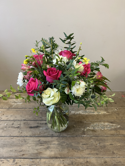 Mother’s Day Vibrant Bloom Vase - Mother’s Day Vibrant Bloom Vase is overflowing with bright pink roses, this eye-catching arrangement captures the energy and warmth of spring in full colour.